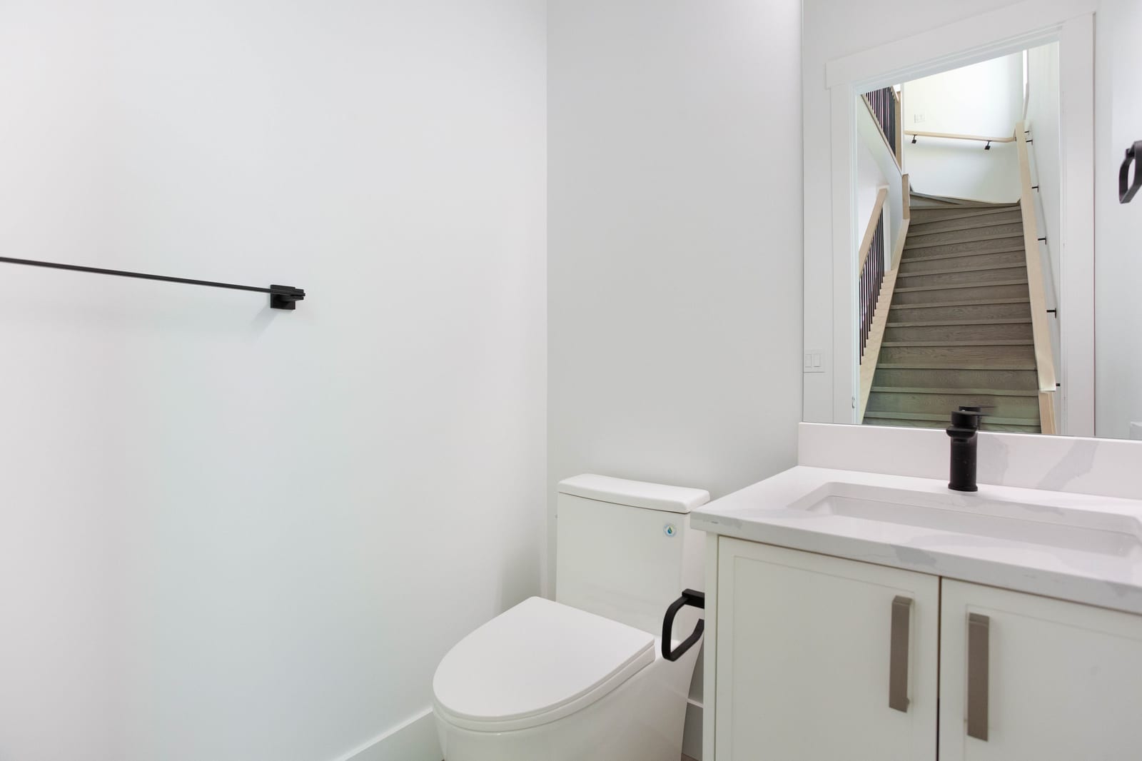 Main-floor half bathroom — supplied paired-home gallery; confirm 1106 finishes