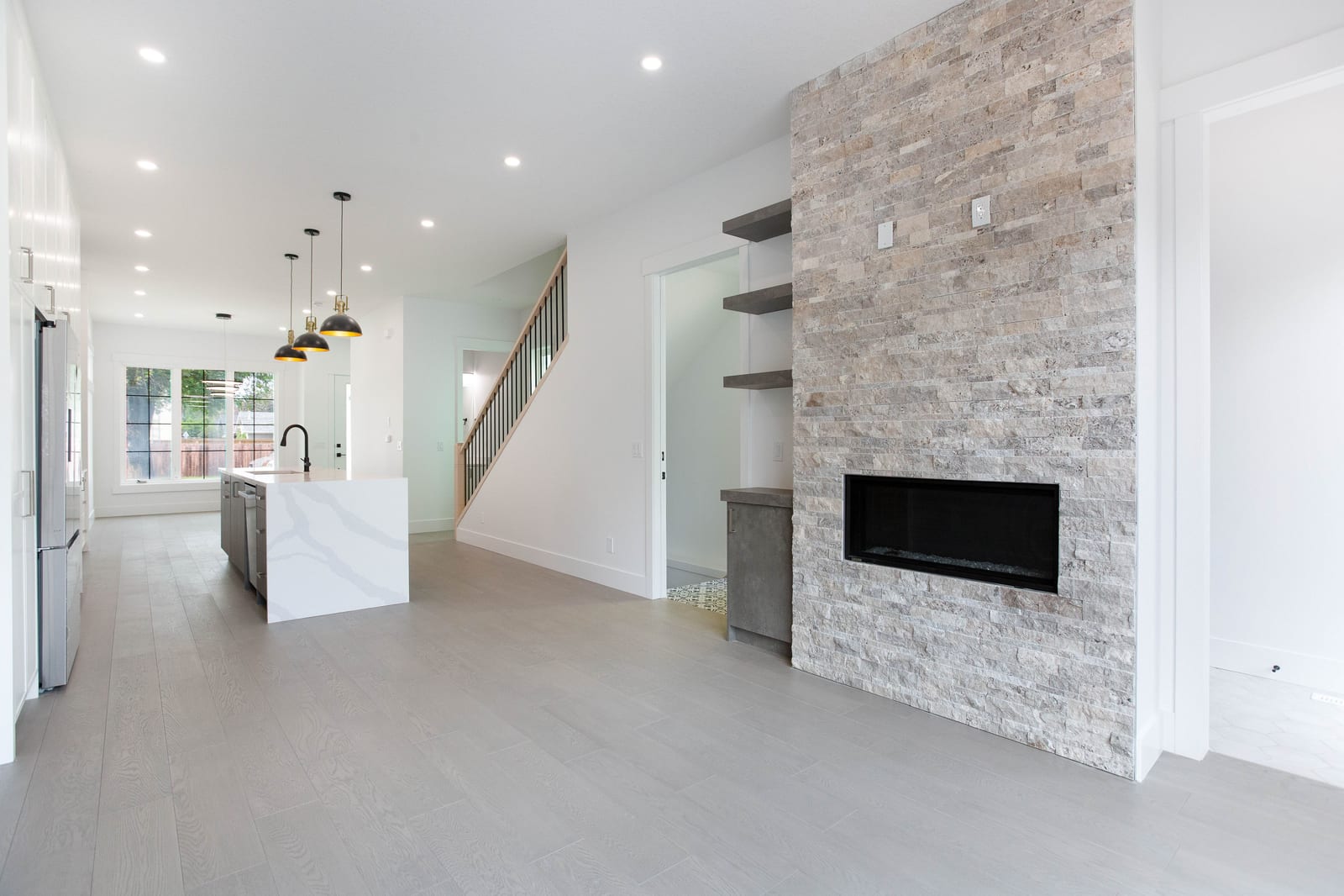 Living room fireplace and connection to the kitchen — supplied paired-home gallery; confirm 1106 finishes