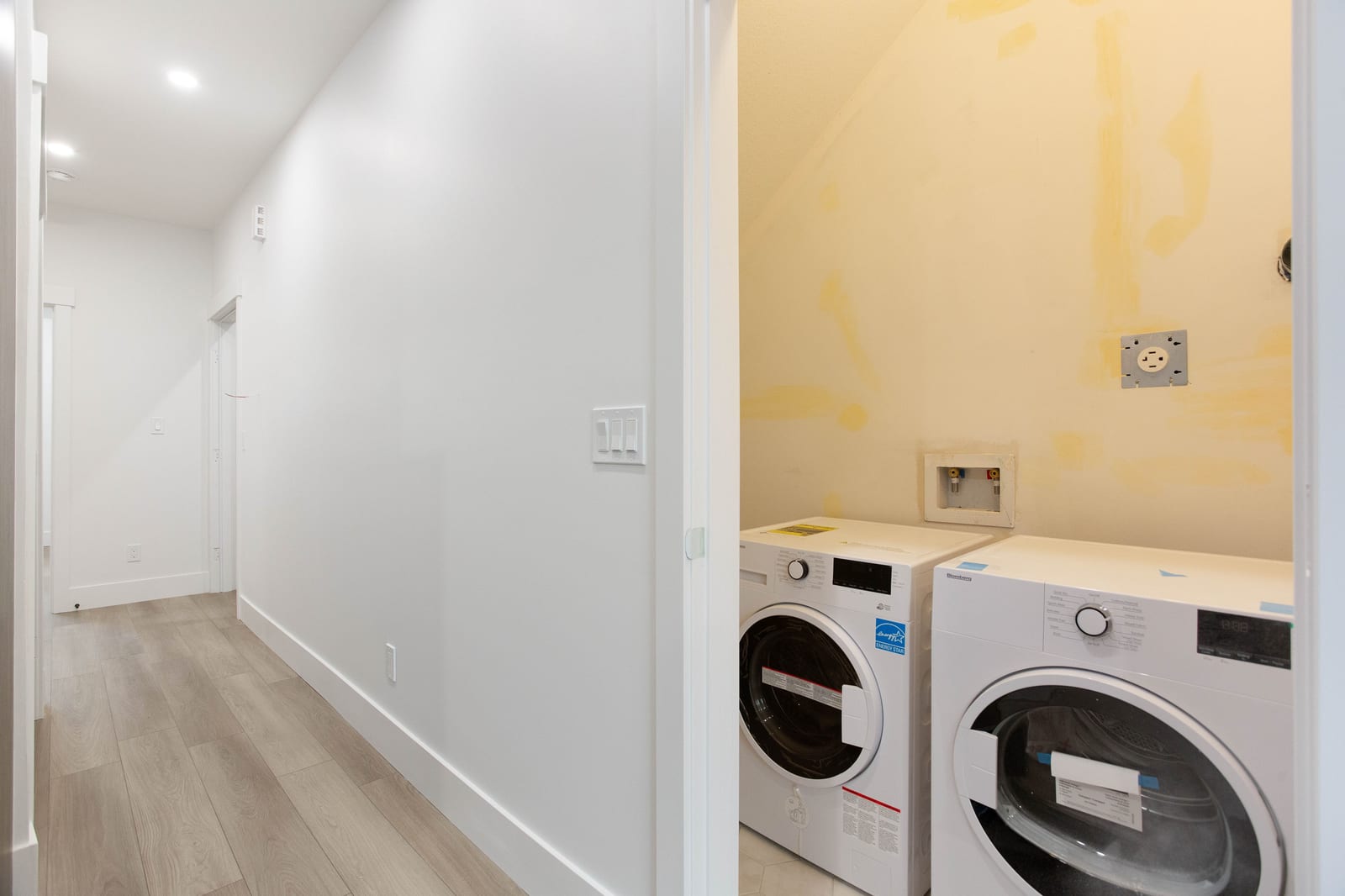 Laundry with side-by-side washer and dryer — supplied paired-home gallery; confirm 1106 finishes