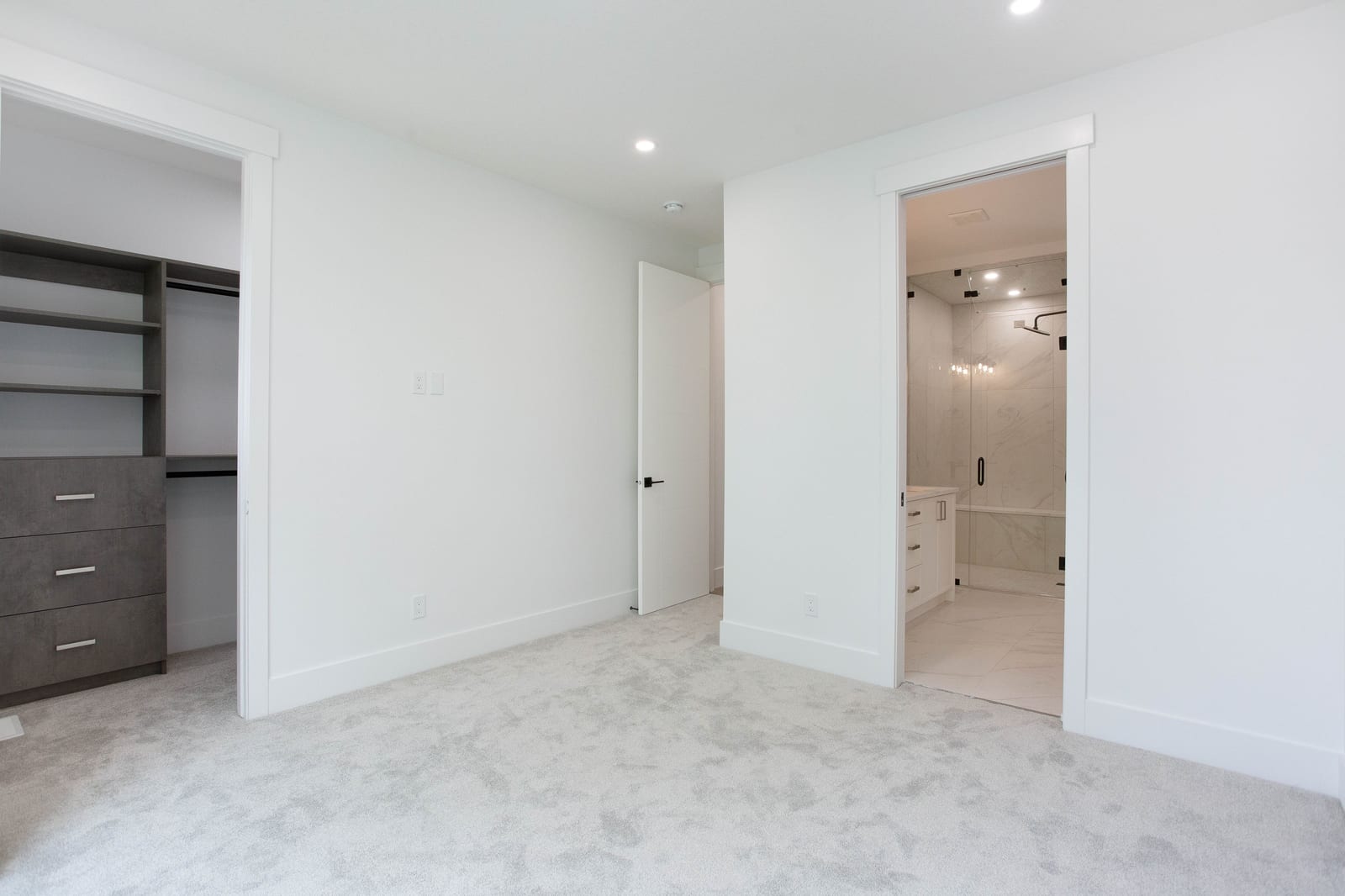 Unfurnished primary bedroom and ensuite doorway — supplied paired-home gallery; confirm 1106 finishes