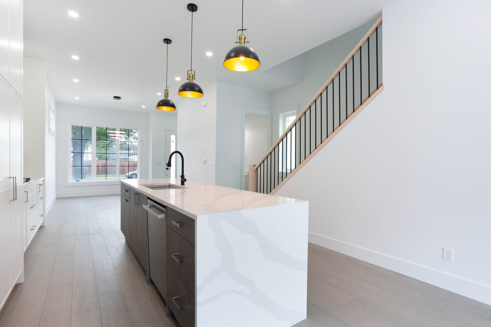 Open kitchen and main-floor circulation — supplied paired-home gallery; confirm 1106 finishes