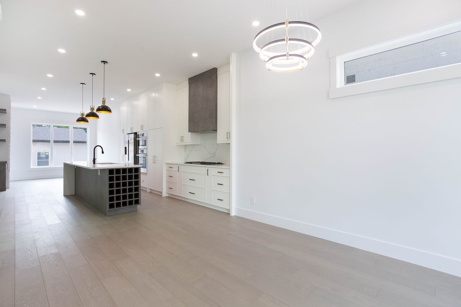 Open main floor connecting dining, kitchen and living — supplied paired-home gallery; confirm 1106 finishes