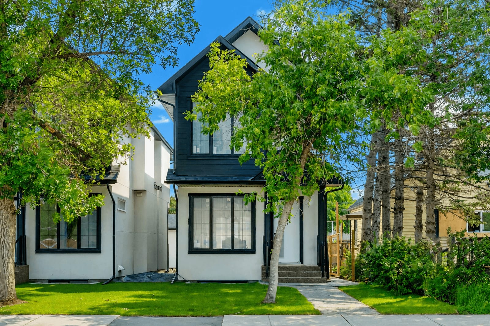 Front exterior of the paired Renfrew homes — supplied 1106 RELA gallery