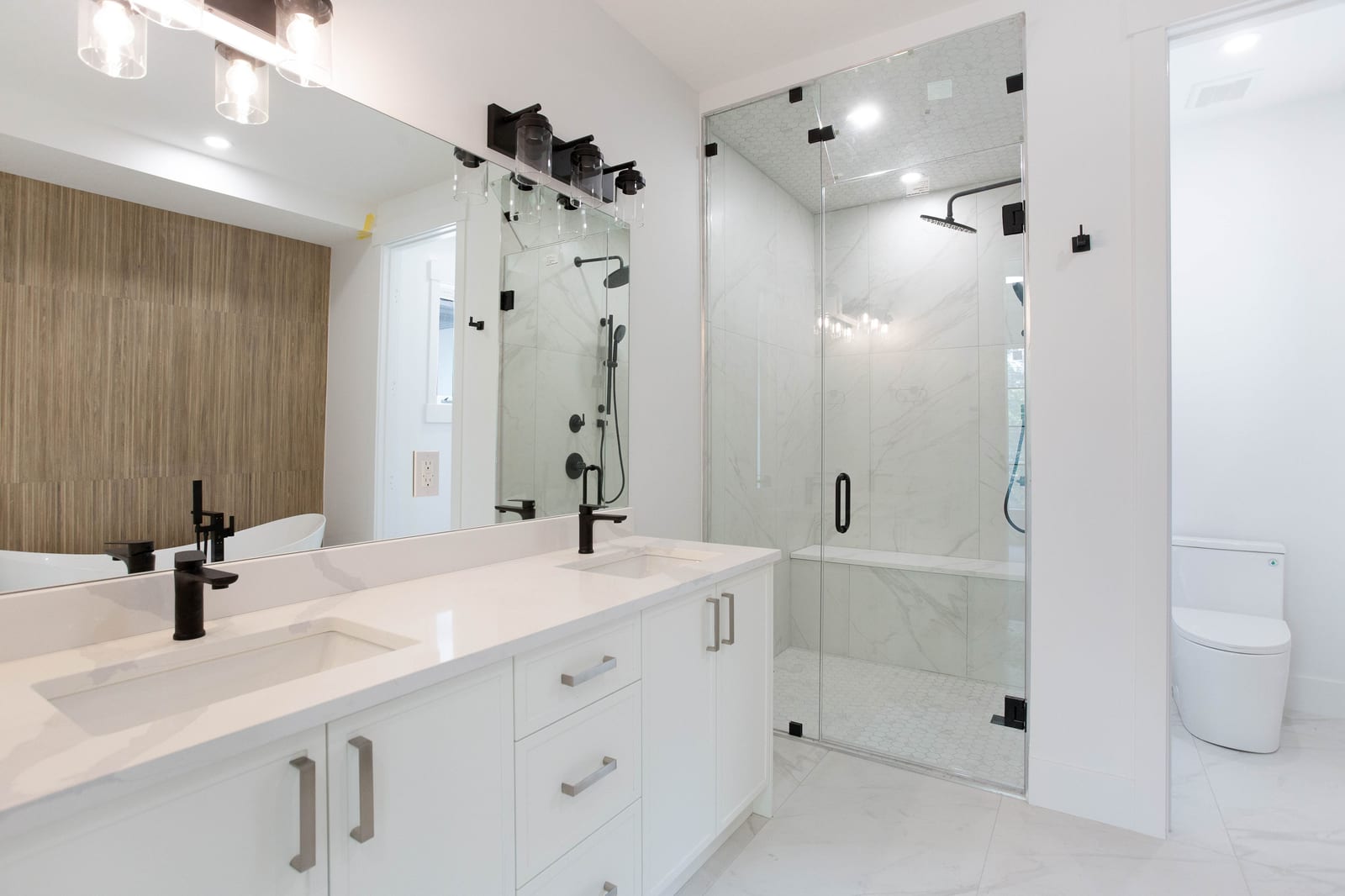 Ensuite vanity and shower — supplied paired-home gallery; confirm 1106 finishes