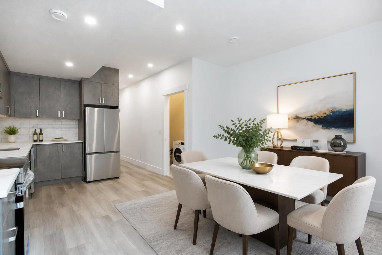Furnished lower-level living presentation; unfurnished views also provided — supplied paired-home gallery; confirm 1106 finishes