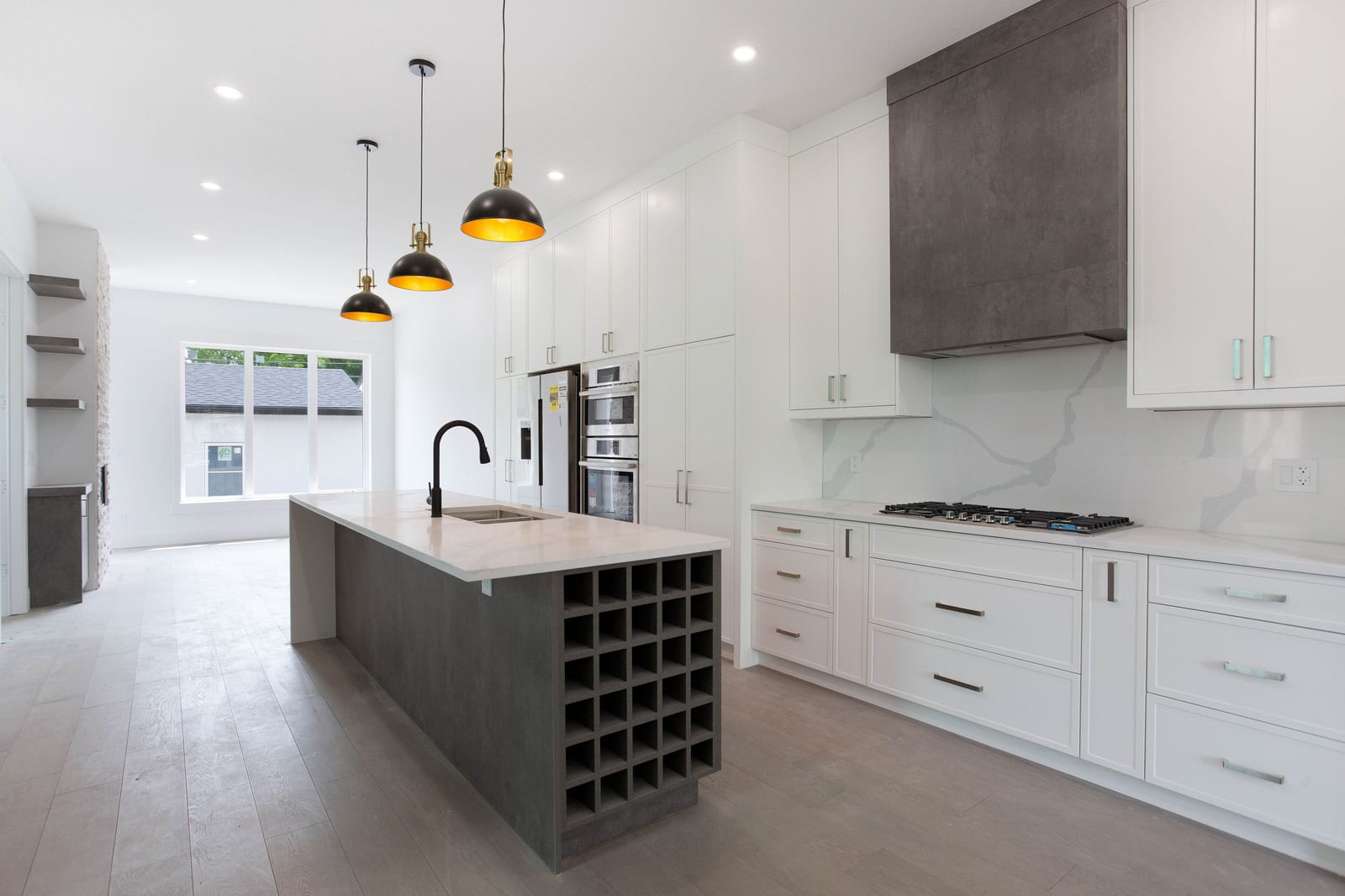 Quartz island and two-tone kitchen cabinetry — supplied paired-home gallery; confirm 1106 finishes