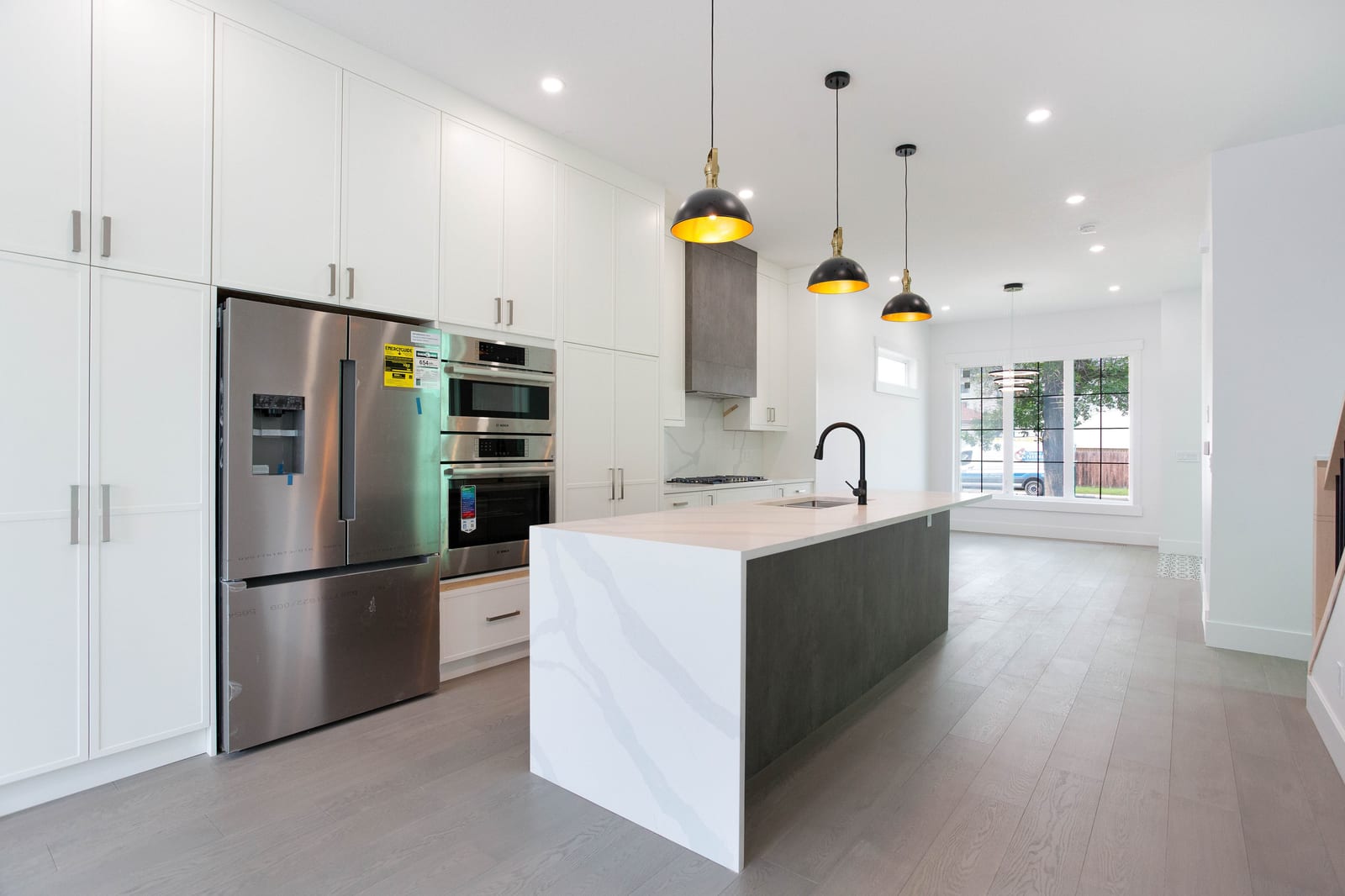 Kitchen with stainless steel appliances — supplied paired-home gallery; confirm 1106 finishes