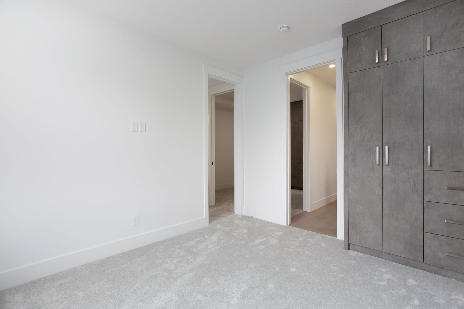 Unfurnished bedroom with built-in closet — supplied paired-home gallery; confirm 1106 finishes