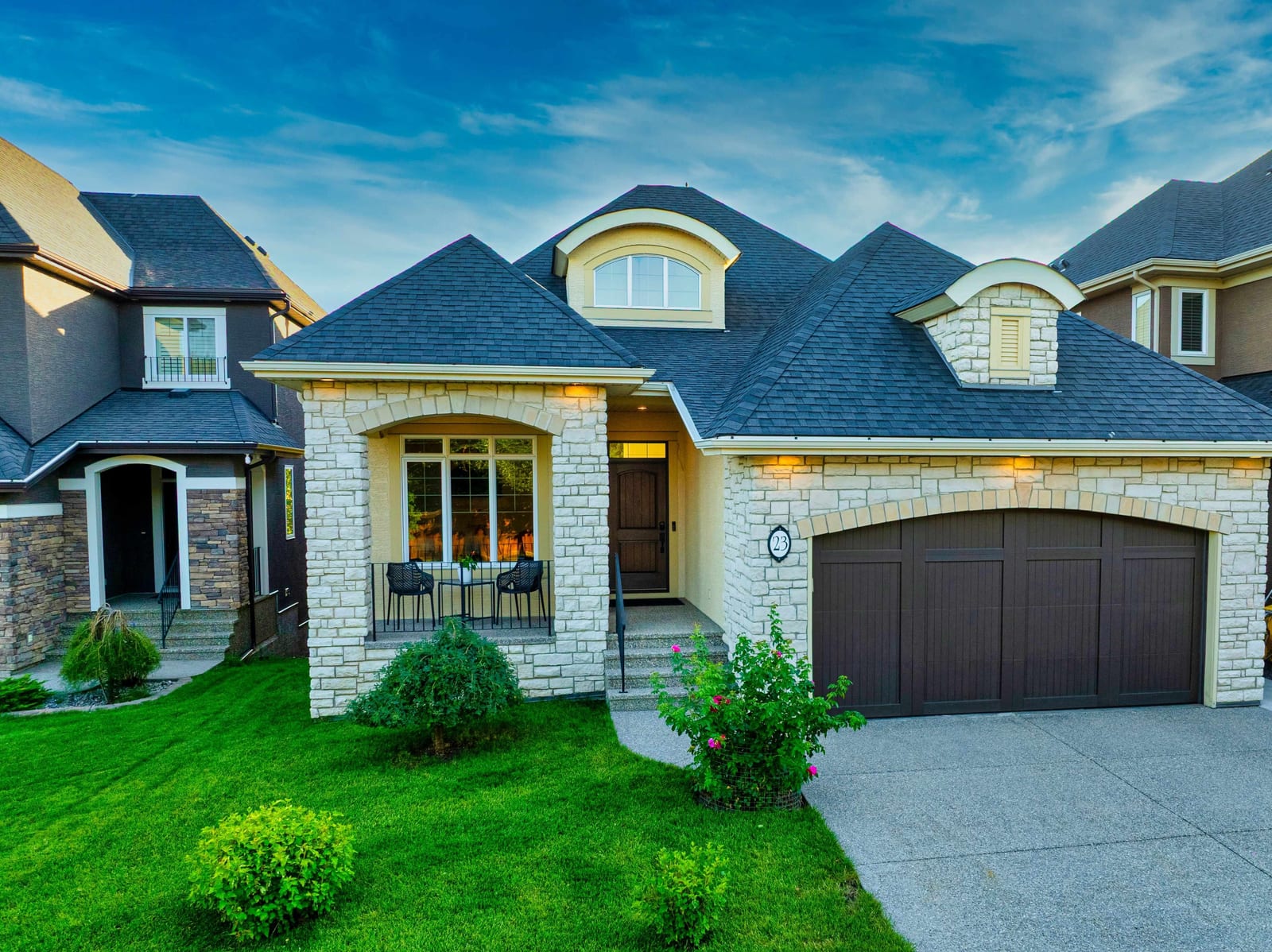 Front exterior and double attached garage