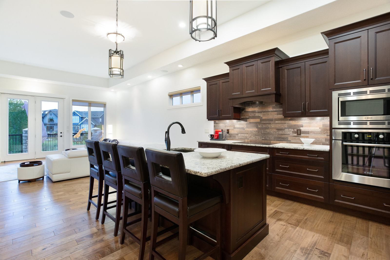 Kitchen island and dark cabinetry