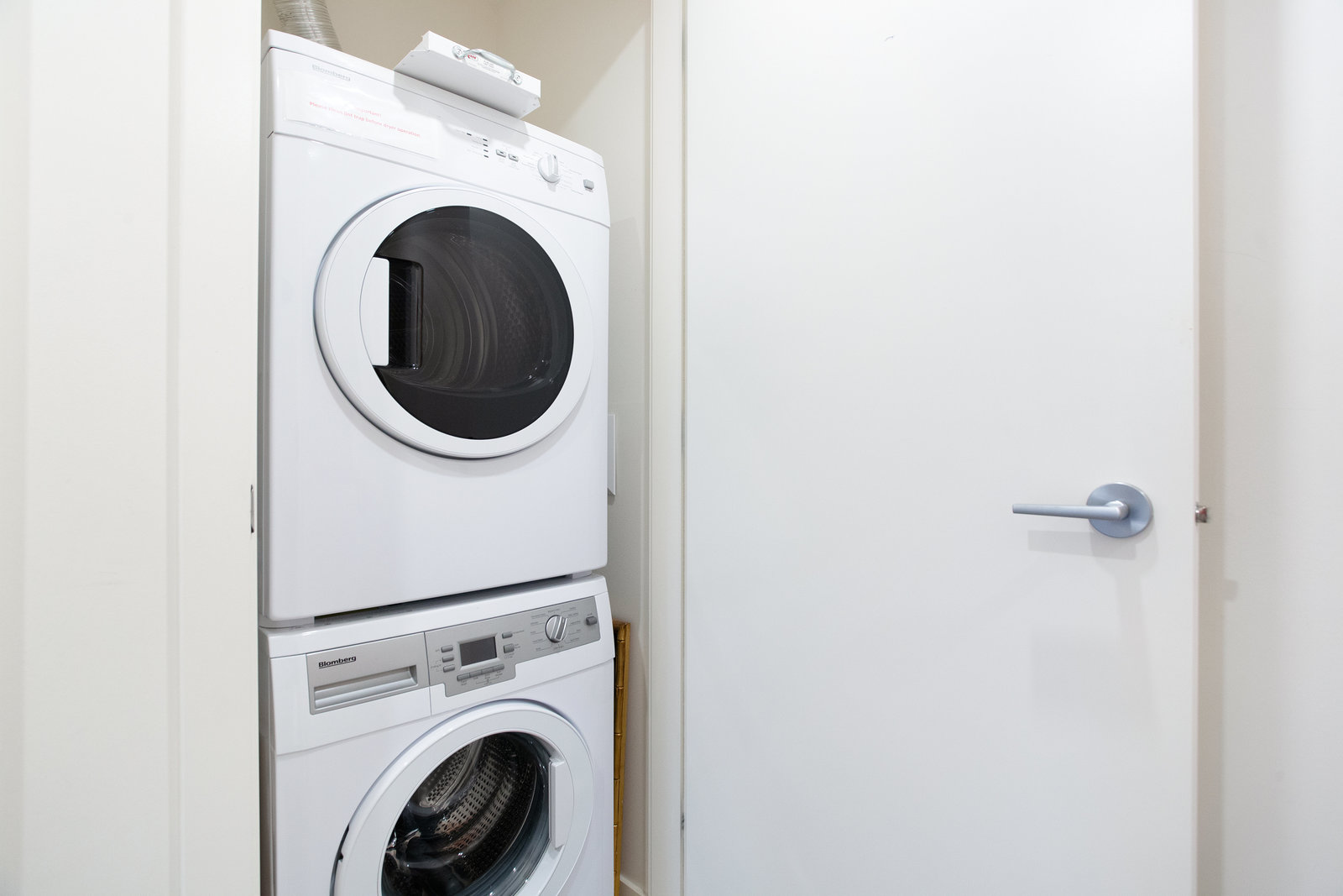 Stacked in-suite washer and dryer
