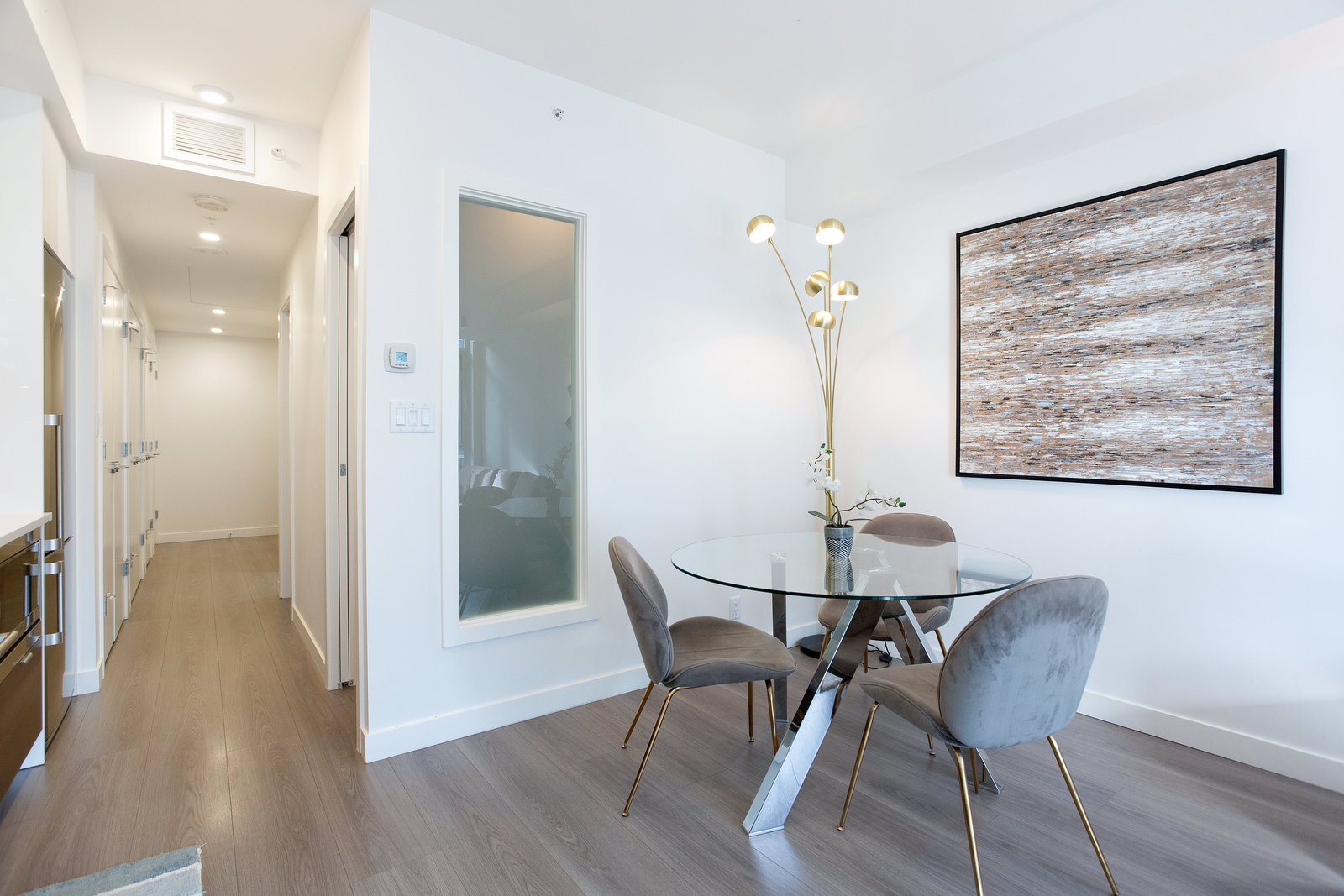 Dining area beside hallway and bedroom door