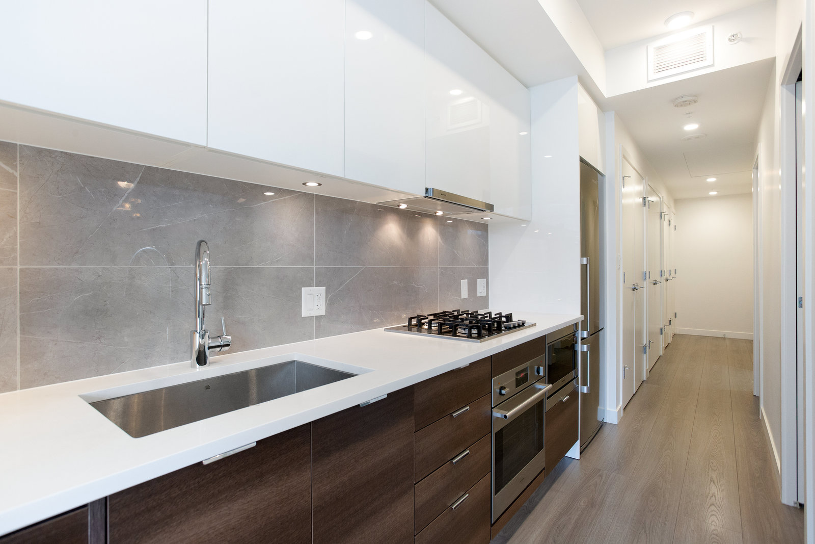 Kitchen sink, quartz counter and cabinetry