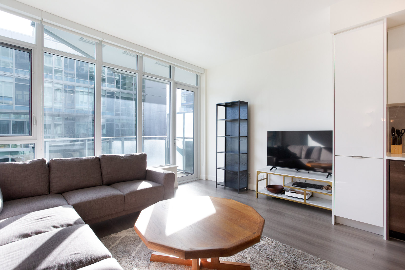 Living room with television and balcony door