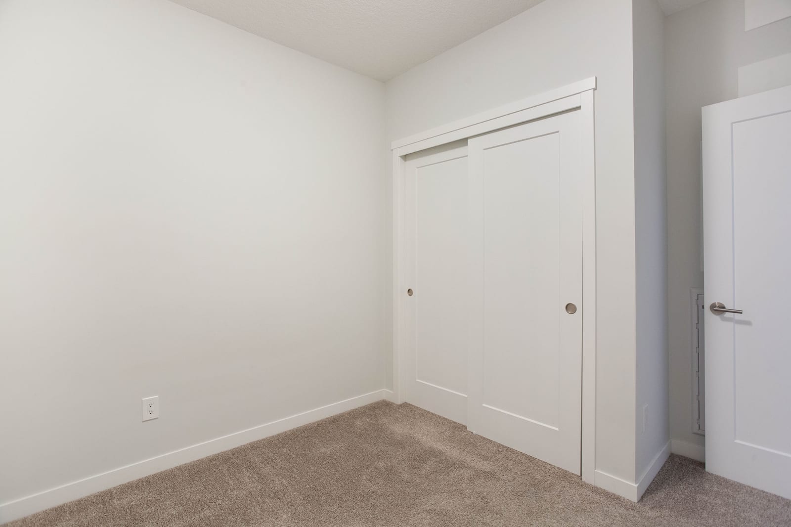 An unfurnished second bedroom